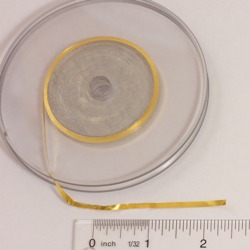 picture of gold ribbon on a spool